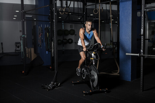 Man with prosthetic leg riding exercycle