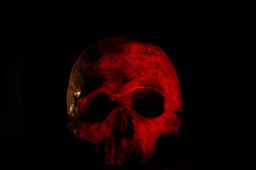 Red skull against dark background