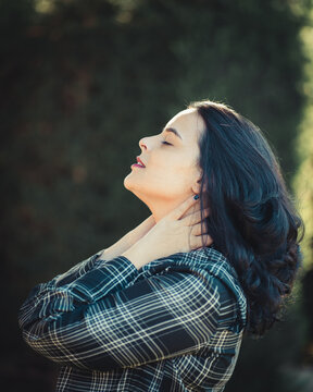 Side View Of Woman Green Plaid Shirt Closing Her Eyes