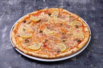 fish pizza on the dark background