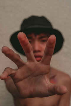 Topless man with dark hat