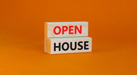 Time to open house symbol. Concept words Open house on wooden blocks on a beautiful orange background. Business and time to open house concept. Copy space.