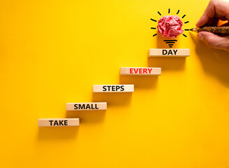 Take small steps every day symbol. Wooden blocks with words Take small steps every day. Beautiful yellow background, copy space. Businessman hand, light bulb. Business, step every day concept.