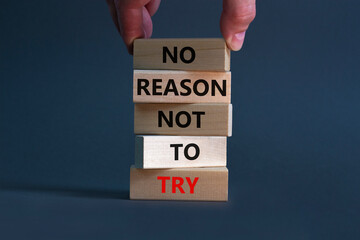 No reason not to try symbol. Wooden blocks with words No reason not to try. Businessman hand....