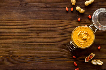 Homemade creamy peanut butter with nuts, top view