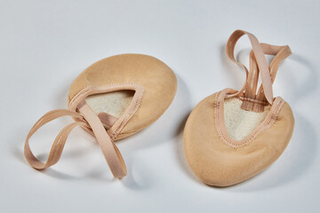 Shoes for rhythmic gymnastics on socks, semi-cylindrical nude-colored shoes