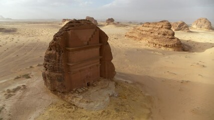 Brown Rock Structure In Desert Against Cloudy Sky - AlUla, Saudi Arabia