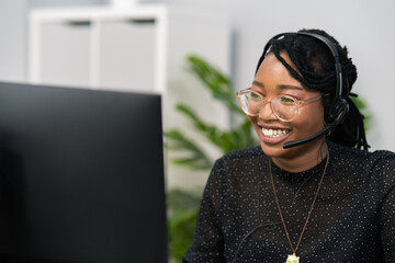 Customer service agent, financial advisor call center employee sits at desk in company in front of...
