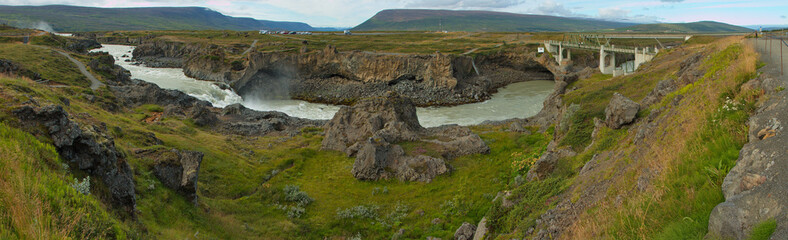 Road bridge and footbridge at the waterfall Geitafoss on the river Skjalfandafljot in Iceland,...