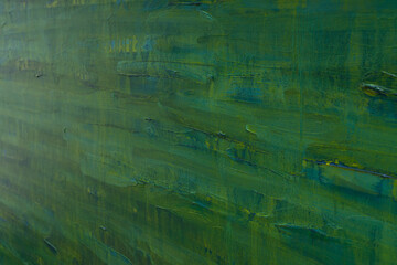 Dark green oil painting with drips close up