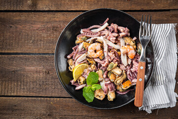 seafood mix shrimp, squid, mussel, octopus fresh meal snack on the table copy space food background 
