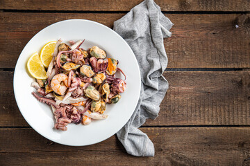 seafood mix shrimp, squid, mussel, octopus fresh meal snack on the table copy space food background 
