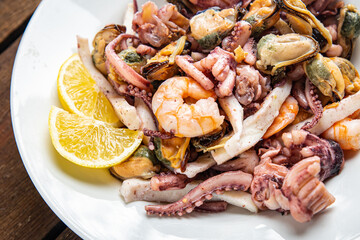 seafood mix shrimp, squid, mussel, octopus fresh meal snack on the table copy space food background 