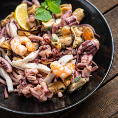 seafood mix shrimp, squid, mussel, octopus fresh meal snack on the table copy space food background 