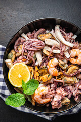 seafood mix shrimp, squid, mussel, octopus fresh meal snack on the table copy space food background 