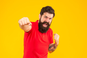 hair and beard care. angry man punching. mature hipster with beard.