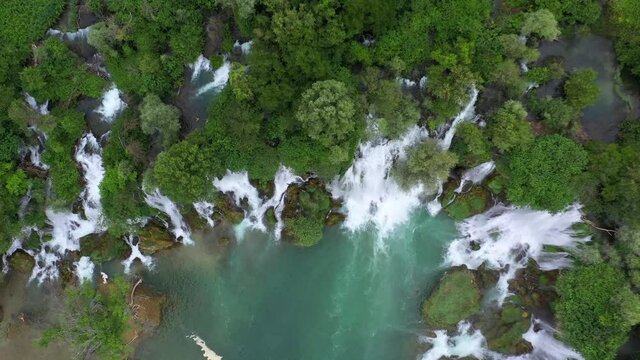 Aerial Top Scenic Shot Of Flowing Water In River, Drone Flying Over Green Forest - Studenci, Bosnia and Herzegovina