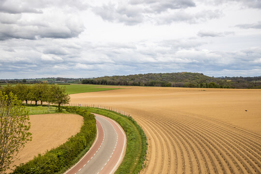 Dutch agriculture landscape devided by a road with cycle lanes