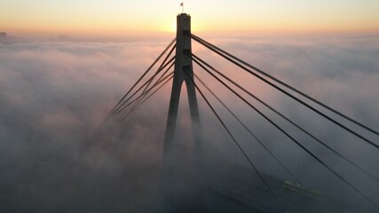 Bridge in the fog on the sunrise 