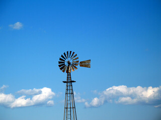 old windmill against sky