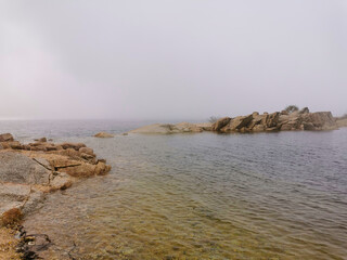 Idyllic landscape of a lagoon in a foggy environment