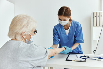 Fototapeta premium elderly woman and doctor Hospital visit medical office