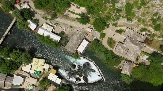 Aerial Top Panning Beautiful Shot Of River At Vrelo Bune During Sunny Day - Blagaj, Bosnia and Herzegovina