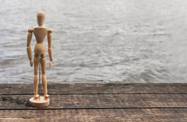 Abstract human alone in silence, sad and pensive, looking in water in despair in solitude. Death...