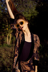 woman wearing sunglasses outdoors posing fashion glamor