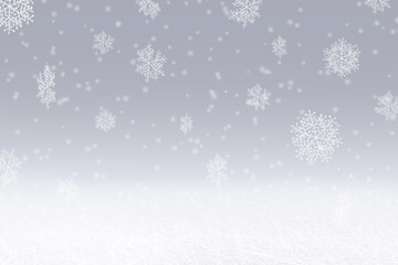 Winter snowfall digital background. Snowflakes falling against a blue / grey sky backdrop. With space for copy or a digital product mockup.