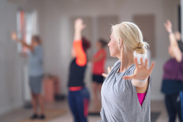 Close-up of a woman during a group yoga class.