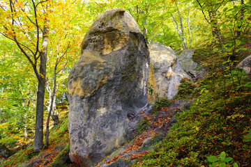 Rocks near the Cave Monastery in Rozhirche, Lviv Oblast, Ukraine. Ancient rocky temple in the forest, in the Carpathian mountains.