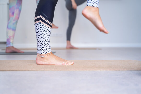 Women's feet during a yoga class