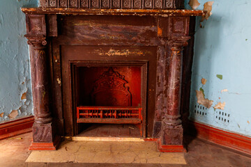 Vintage fireplace in a living room of abandoned palace
