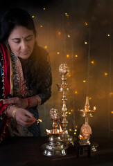 Woman lighting lamp 