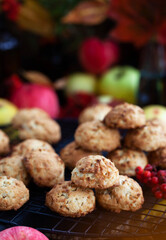 Homemade delicious apple cookies on rustic autumn background