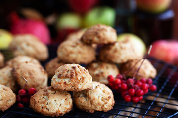 Homemade delicious apple cookies on rustic autumn background