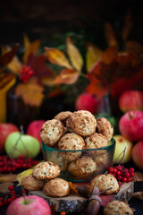 Homemade delicious apple cookies on rustic autumn background