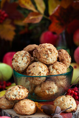 Homemade delicious apple cookies on rustic autumn background