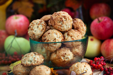 Homemade delicious apple cookies on rustic autumn background