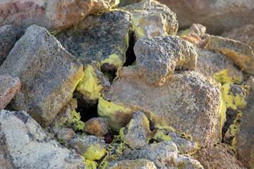 Landscape of yellow sulfur covered rocks at Mt. Námafjall Fumaroles Diamond Circle Iceland