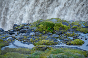 Landscape of grassy rocks and Detifoss waterfall Diamond Circle Iceland