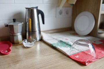 two small coffee makers in the kitchen