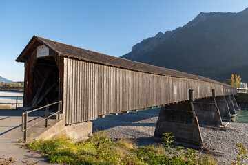 Fototapeta na wymiar Sevelen, Switzerland, October 11, 2021 Old bridge over the rhine river