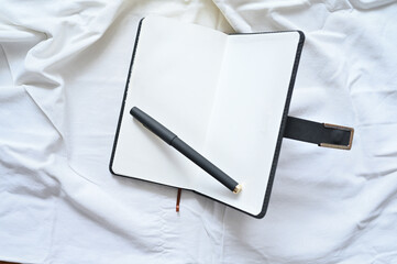 Open notebook with space for writing. The concept of writing thoughts and ideas. Business layout. Flat lay