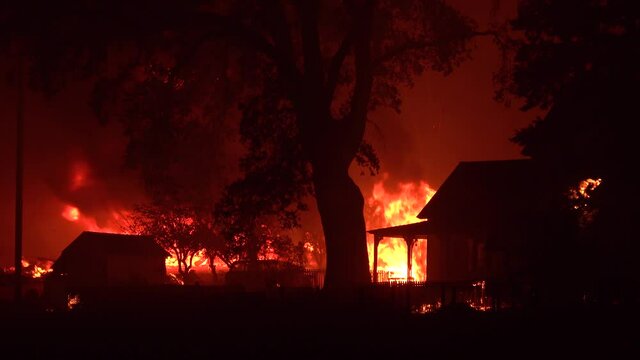 2021 - A house is engulfed in flames at night during the disastrous Dixie Fire in Northern California.