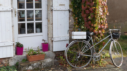 Fototapeta na wymiar Bike parked against an open doorway