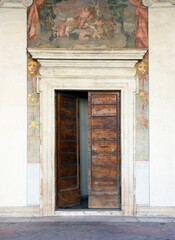 Fototapeta na wymiar Wooden doorway and frescoes at Villa Giulia, Rome, 2021.