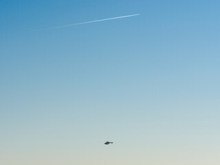 helicopter and airplane in the sky