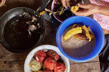 Documentary photography preparation of Oaxacan mole in Mexico, in a traditional way. Oaxacan tamales. Mexican food. Latin food. Spicy food.